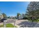 Street view of the 6754-6830 S. Independence St community entrance with lush landscaping at 6774 S Independence St, Littleton, CO 80128