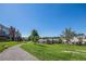 A grassy area and walking path in the community gives lots of space for walking and relaxation at 6774 S Independence St, Littleton, CO 80128