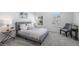 Serene main bedroom with neutral tones, two large windows, and plush carpet at 6774 S Independence St, Littleton, CO 80128