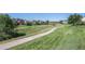 The community offers scenic walking path surrounded by green spaces and mature trees at 6774 S Independence St, Littleton, CO 80128
