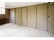 Unfinished basement area featuring three storage closets and a small window for natural light at 827 Maxwell Ave # H, Boulder, CO 80304