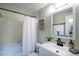 Well-lit bathroom featuring a bathtub, shower, vanity, mirror, and a towel rack at 827 Maxwell Ave # H, Boulder, CO 80304