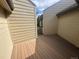 Outdoor deck between two buildings. The deck has brown wood-like planks at 827 Maxwell Ave # H, Boulder, CO 80304