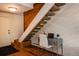 Entryway featuring hardwood floors, stairs, and a small office space at 827 Maxwell Ave # H, Boulder, CO 80304