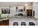 Kitchen with stainless steel appliances, granite countertops, and eat-in breakfast bar at 827 Maxwell Ave # H, Boulder, CO 80304
