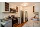 Kitchen boasts stainless steel appliances, granite countertops, subway tile backsplash, and walk-in pantry at 827 Maxwell Ave # H, Boulder, CO 80304