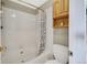 Bathroom with tub and tiled walls at 1099 S Walden Way # 205, Aurora, CO 80017