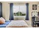 Bedroom view with large window and natural light at 1099 S Walden Way # 205, Aurora, CO 80017