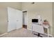 Comfortable bedroom space with white closet doors and a work desk area at 1099 S Walden Way # 205, Aurora, CO 80017