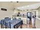 Functional kitchen adjacent to dining space, showcasing granite countertops, modern appliances, and hardwood floors at 1099 S Walden Way # 205, Aurora, CO 80017
