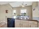 Bright kitchen and dining area with granite countertops and stainless steel double-basin sink at 1099 S Walden Way # 205, Aurora, CO 80017