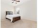 Bright bedroom featuring a ceiling fan, and a window that lets in natural light at 8101 S Quatar Cir, Aurora, CO 80016