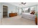 Large main bedroom with trey ceilings, walk-in closet, and large windows at 8101 S Quatar Cir, Aurora, CO 80016