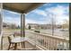 Cozy front porch with comfortable seating, offering a relaxing outdoor space with neighborhood views at 8101 S Quatar Cir, Aurora, CO 80016