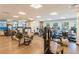 Well-equipped fitness center with modern exercise machines and mirrored wall, offering a premium workout experience at 8101 S Quatar Cir, Aurora, CO 80016