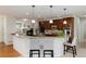 Modern kitchen featuring granite countertops, stainless steel appliances, and a breakfast bar for casual dining at 8101 S Quatar Cir, Aurora, CO 80016