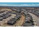 Panoramic aerial view showcasing a well-planned community with similar homes against a mountain backdrop at 8501 S Rome Way, Aurora, CO 80016