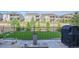 This backyard is perfect for recreation and relaxation with its artificial turf, fence, and well-manicured landscaping at 8501 S Rome Way, Aurora, CO 80016