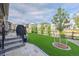 This backyard offers artificial turf, professional landscaping, and easy access to neighborhood amenities at 8501 S Rome Way, Aurora, CO 80016