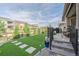 Step into outdoor living with a beautiful backyard featuring artificial turf, a patio, and neighborhood views at 8501 S Rome Way, Aurora, CO 80016