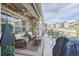 Enjoy outdoor living on this patio with wicker seating, a ceiling fan, and views of the community at 8501 S Rome Way, Aurora, CO 80016