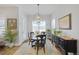 Bright dining room featuring elegant furnishings, natural light, and stylish decor at 8501 S Rome Way, Aurora, CO 80016