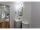 Bright bathroom featuring a modern vanity, updated fixtures, and tiled walls at 5810 S Greenwood St, Littleton, CO 80120