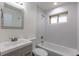 Modern bathroom featuring tiled shower and bath, vanity mirror, and contemporary sink at 5810 S Greenwood St, Littleton, CO 80120
