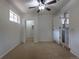 Bedroom with carpet, ceiling fan, closet, and laundry room for added convenience at 5810 S Greenwood St, Littleton, CO 80120