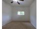 Bedroom featuring carpet, a window for natural light, and neutral paint at 5810 S Greenwood St, Littleton, CO 80120