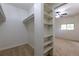 Walk-in closet with built-in shelving and rod, offering ample storage space at 5810 S Greenwood St, Littleton, CO 80120