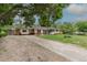 Lovely home with a long driveway and mature tree, offering a serene and welcoming curb appeal at 5810 S Greenwood St, Littleton, CO 80120