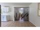 Bright kitchen features tile floors, white cabinets, and a unique sliding door with a stone design at 5810 S Greenwood St, Littleton, CO 80120