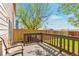This stained back deck offers seating and plenty of room to BBQ and enjoy the view at 1030 E 78Th Pl, Denver, CO 80229