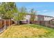 A well-manicured back yard is fully fenced for privacy with a back deck and plenty of green space at 1030 E 78Th Pl, Denver, CO 80229
