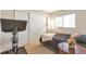 A cozy bedroom features a window, large closet and bedside table at 1030 E 78Th Pl, Denver, CO 80229