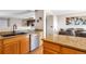 Spacious kitchen featuring granite countertops, stainless steel appliances, and an adjacent dining area for entertaining at 1030 E 78Th Pl, Denver, CO 80229
