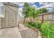Backyard with charming garden area, a concrete patio, and a wood fence at 1148 S Ventura Cir # H, Aurora, CO 80017
