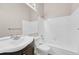 Clean bathroom featuring a white vanity, toilet, and a combined shower and tub with white tiles at 1148 S Ventura Cir # H, Aurora, CO 80017