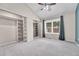 Cozy bedroom with neutral carpet, organized closets, and a bright window, creating a serene atmosphere at 1148 S Ventura Cir # H, Aurora, CO 80017