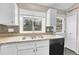 Cozy kitchen featuring granite counters, a window above the sink, and lots of natural light at 1148 S Ventura Cir # H, Aurora, CO 80017