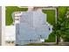 Aerial view of a meticulously landscaped home, featuring a large roof, patio, green lawn, and driveway at 6888 Howell St, Arvada, CO 80004