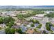 View of residential area with lush green trees and mountains in the distance at 6888 Howell St, Arvada, CO 80004