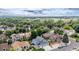 Neighborhood aerial shot with mature trees and mountain views in the distance at 6888 Howell St, Arvada, CO 80004