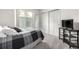 Comfortable bedroom with a soft bed, window, TV, and closet with mirror at 6888 Howell St, Arvada, CO 80004