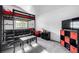 Bedroom featuring a lofted bed, couch, and a television on a shelf at 6888 Howell St, Arvada, CO 80004