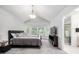 Bright bedroom with a large window, plush carpet, and an en-suite bathroom at 6888 Howell St, Arvada, CO 80004