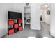 Bedroom with red accents and including access to a closet at 6888 Howell St, Arvada, CO 80004