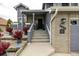 Close up of the front steps with decorative plants leading to the front door at 6888 Howell St, Arvada, CO 80004
