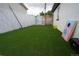 Well-maintained backyard with artificial turf, offering a low-maintenance and visually appealing outdoor space at 7799 Pecos St, Denver, CO 80221